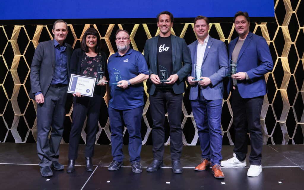 Simon Ouellette, left, CEO of ChargeHub, with Aida Sarroca of BC Hydro, and representatives from Circuit électric, Flo, Hypercharge, and Tesla Charging